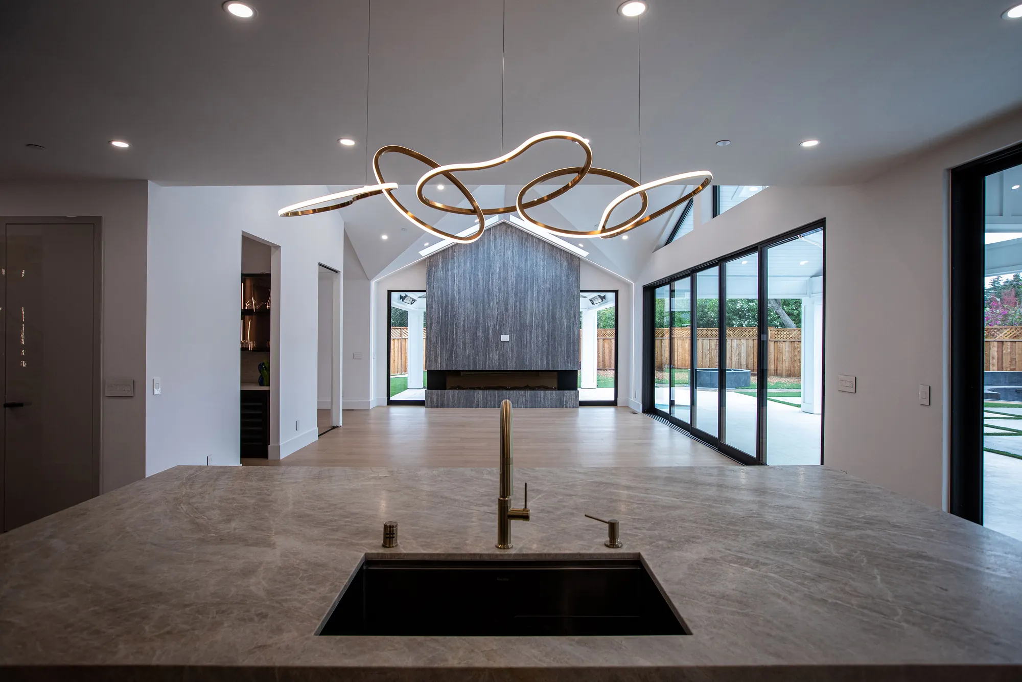 Flawless interior design and construction execution of a Bay Area bespoke home featuring vaulted ceilings and custom lighting.