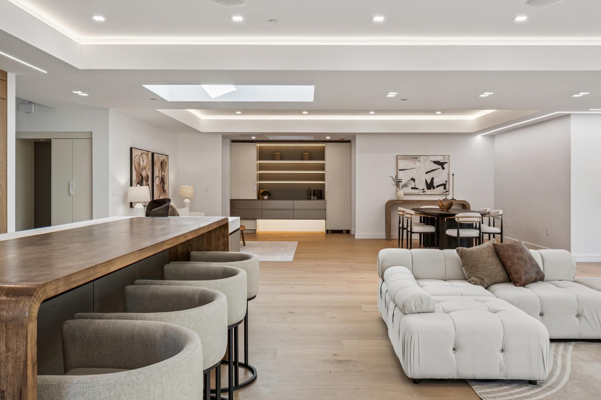 High-end architectural custom home interior layout in San Jose, showcasing wide-plank oak flooring, clean layout transitions, and flawless continuous wood details.