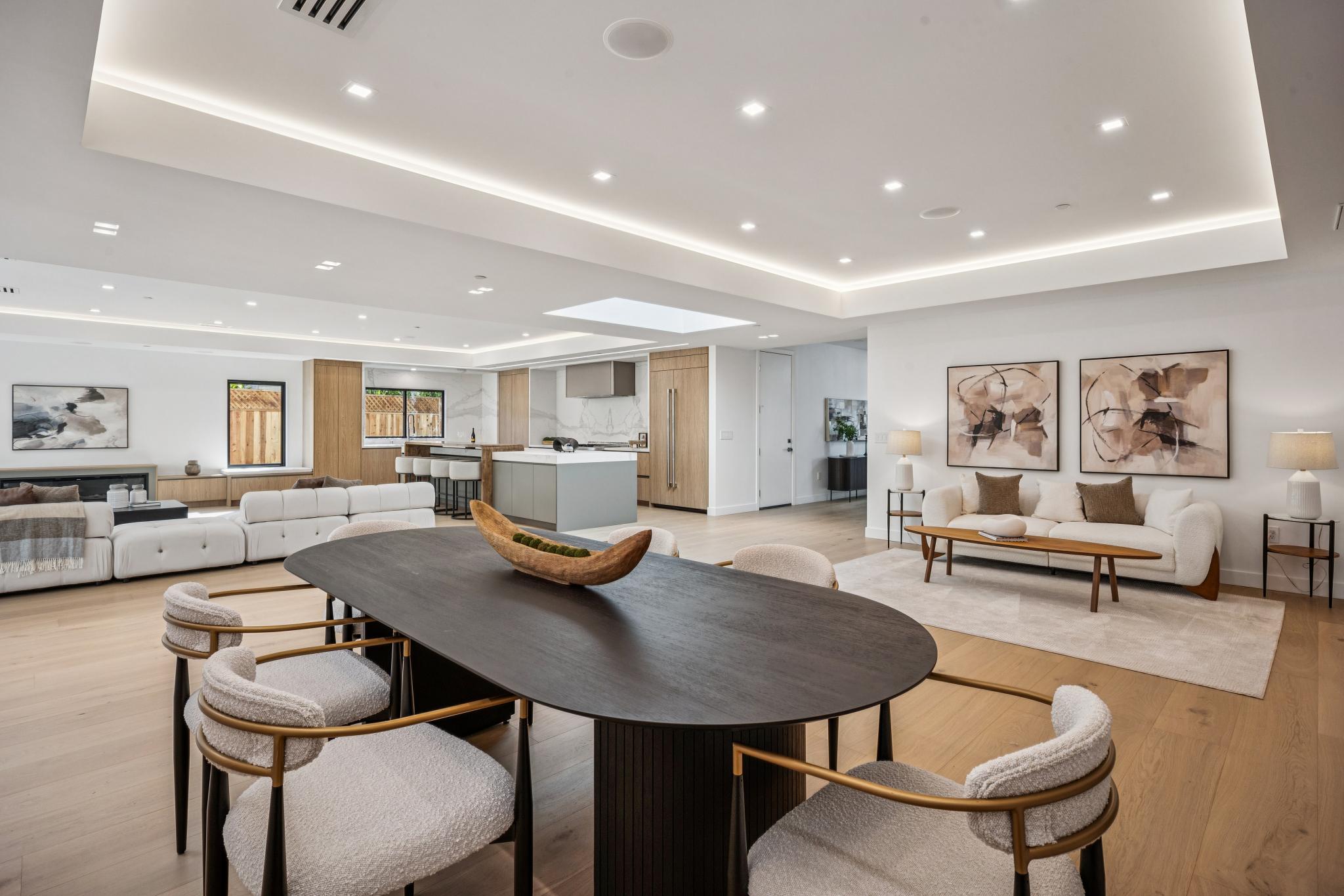 Expansive luxury home open floor plan in Willow Glen, perfectly connecting the dining zone, gourmet kitchen, and secondary formal living spaces.
