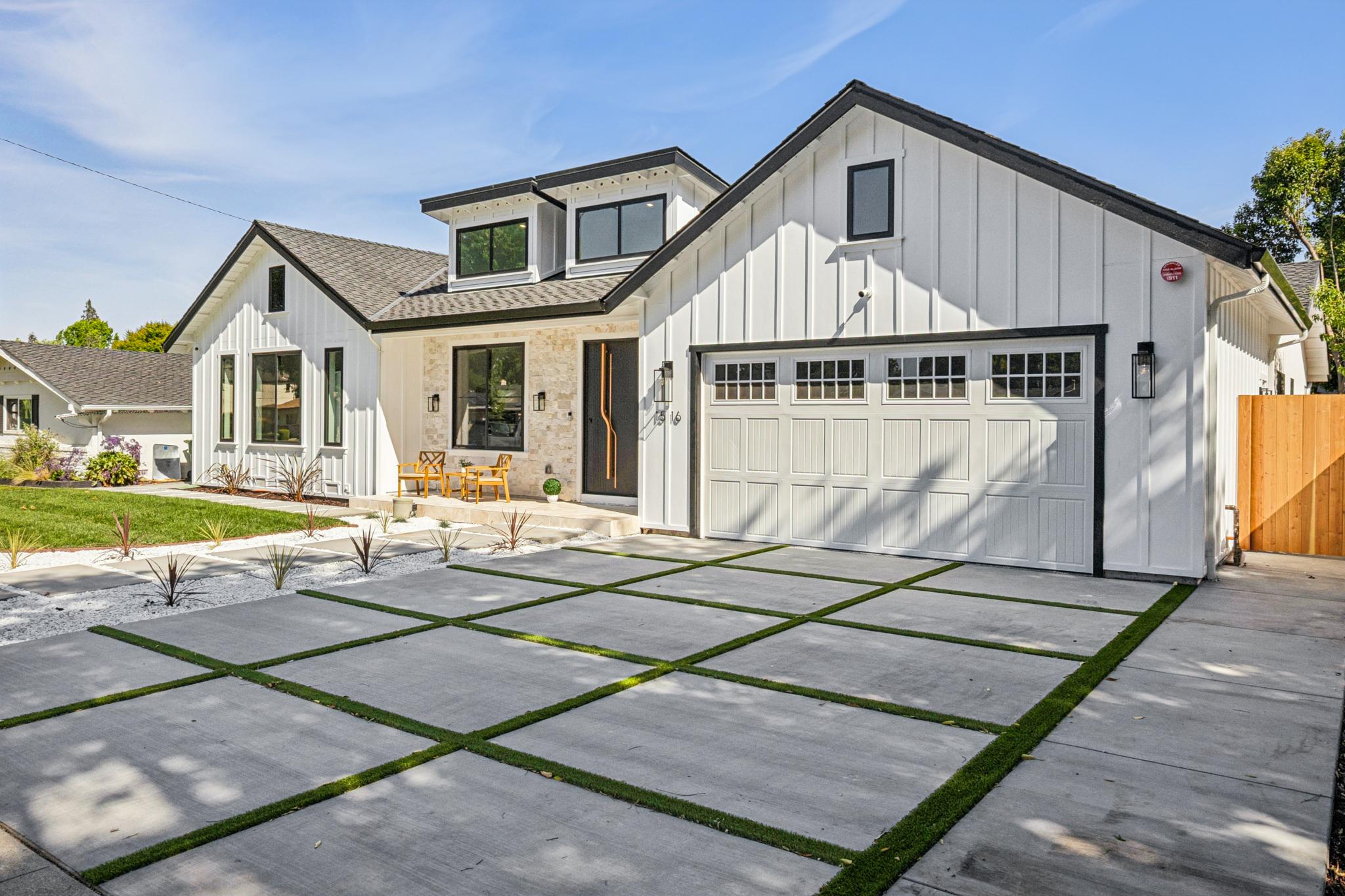 Luxury single-story custom home facade in San Jose, California, showcasing modern farmhouse architecture, clean architectural lines, and premium concrete grid driveway landscaping.