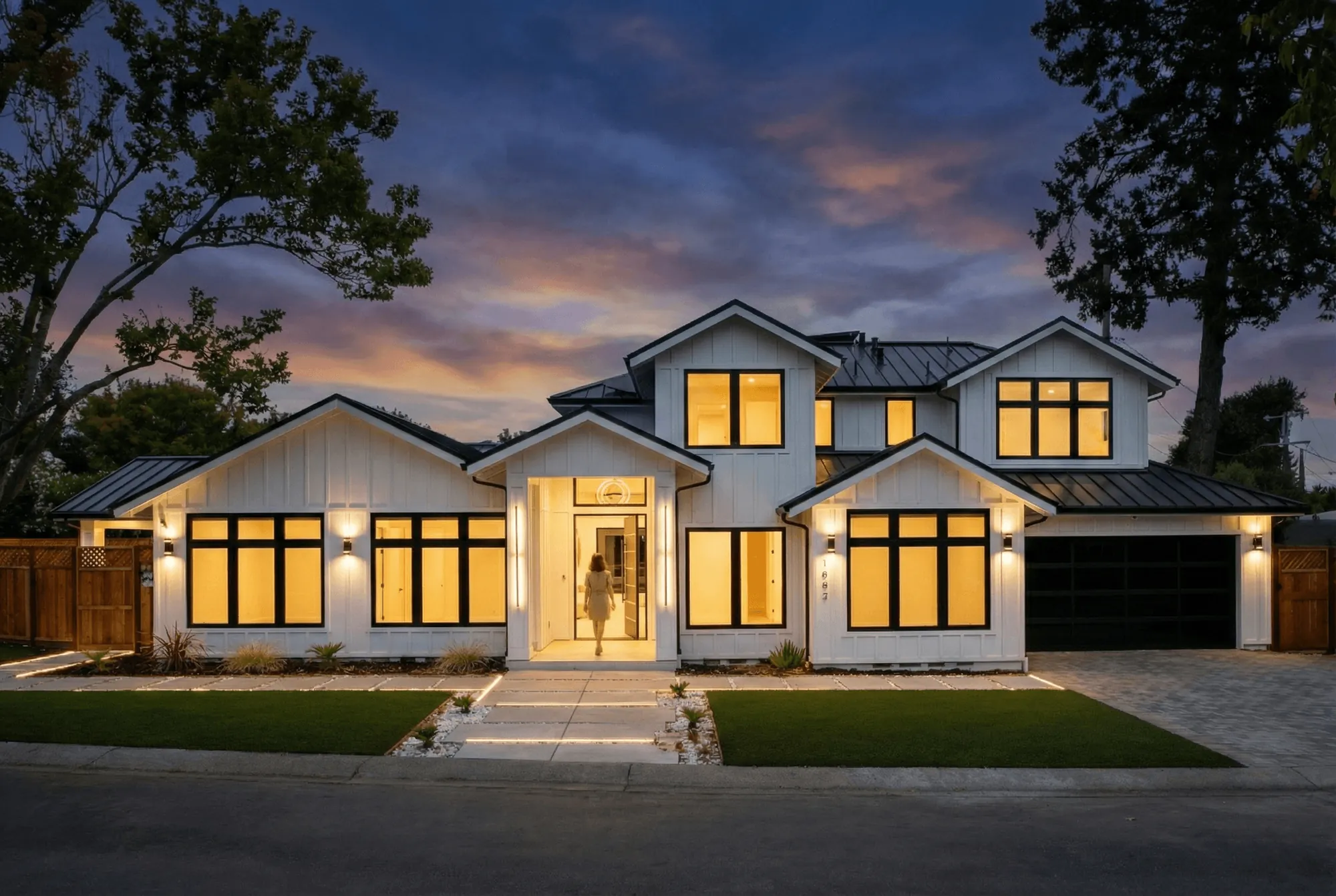 Homeowner walking into a newly constructed luxury custom home in the Bay Area at twilight.