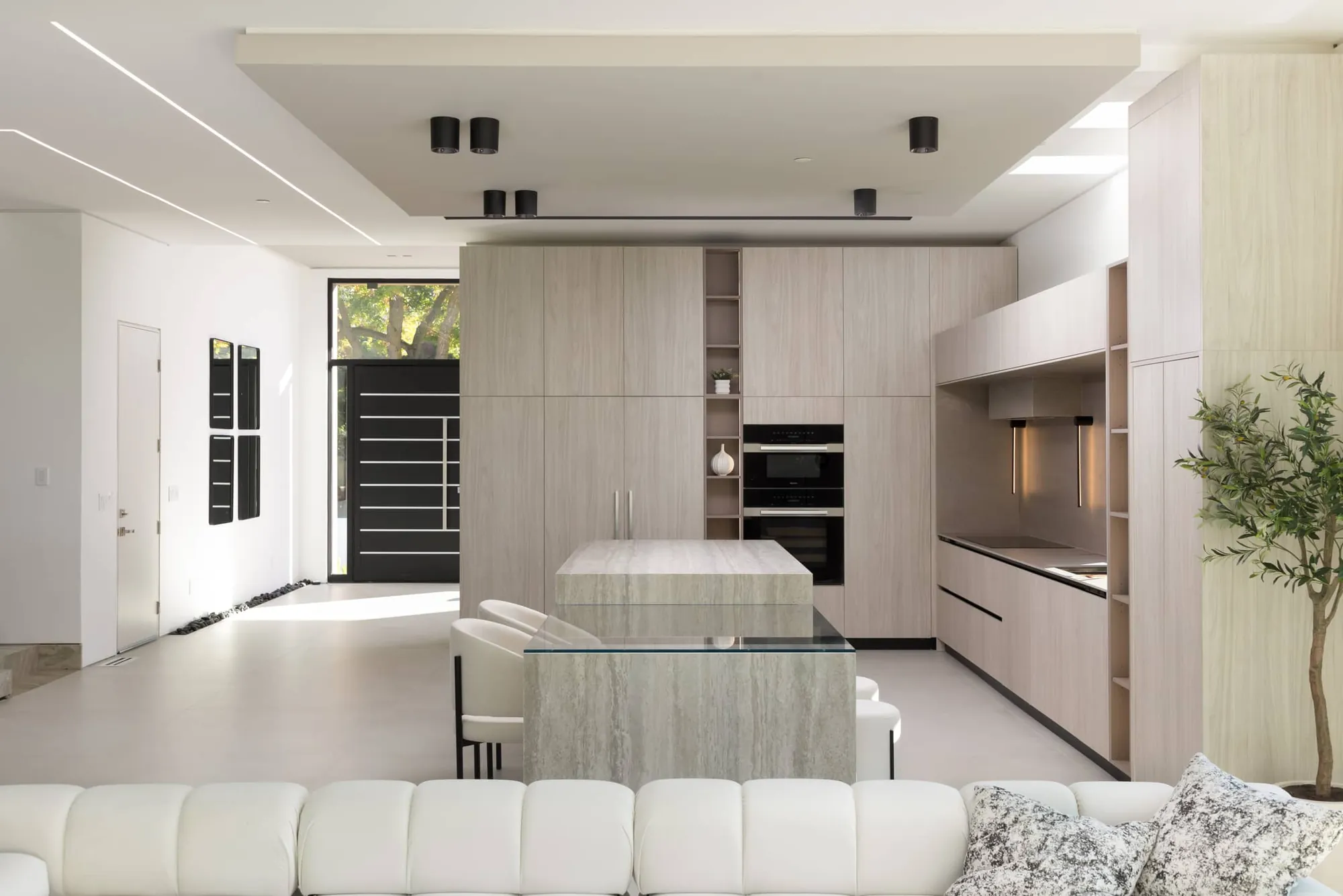 Reconfigured luxury home interior featuring an open custom kitchen, premium millwork, and seamless room-to-room spatial flow