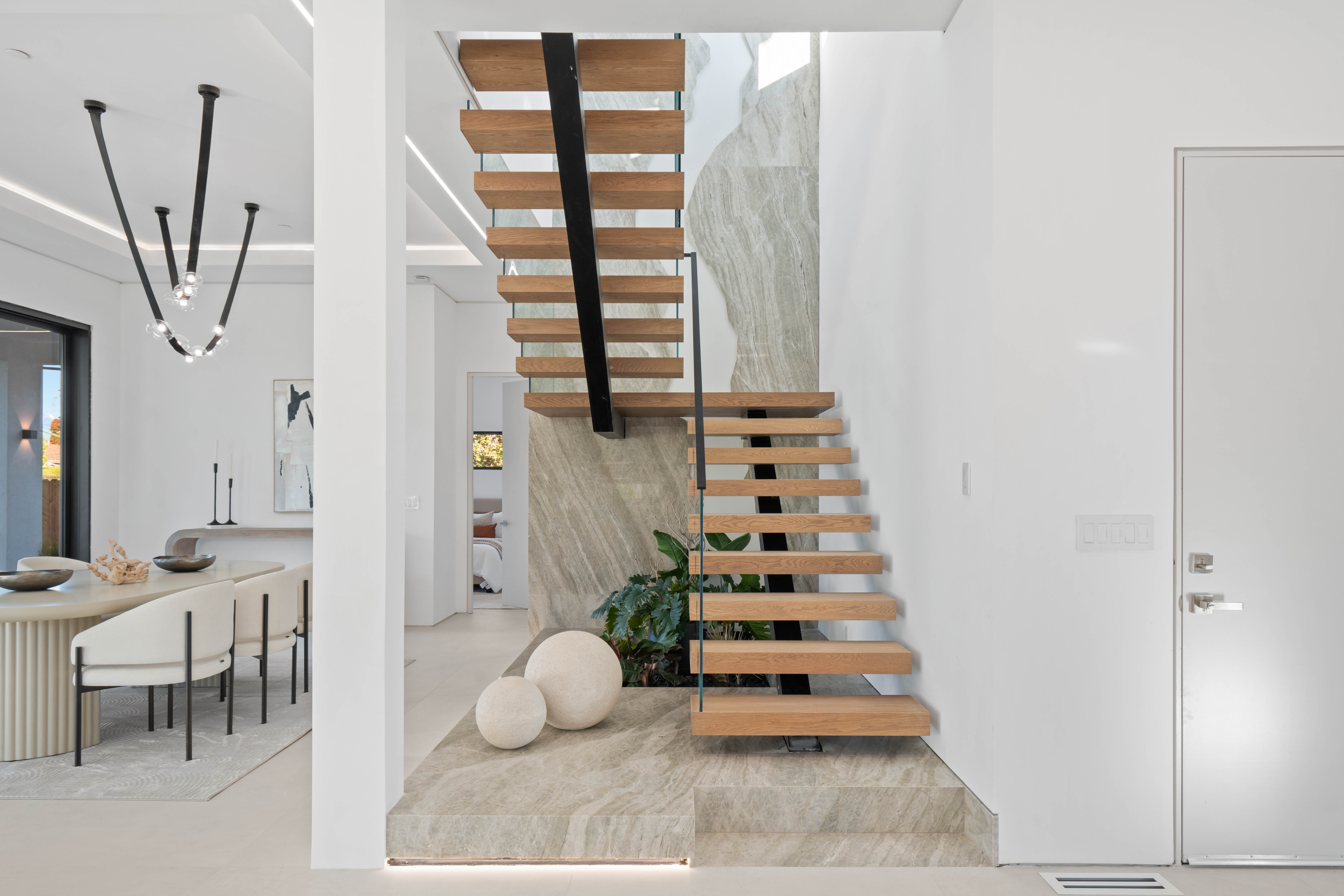 Custom interior shot of Atherton California home floating stairs which were designed and built by Ritz Builders