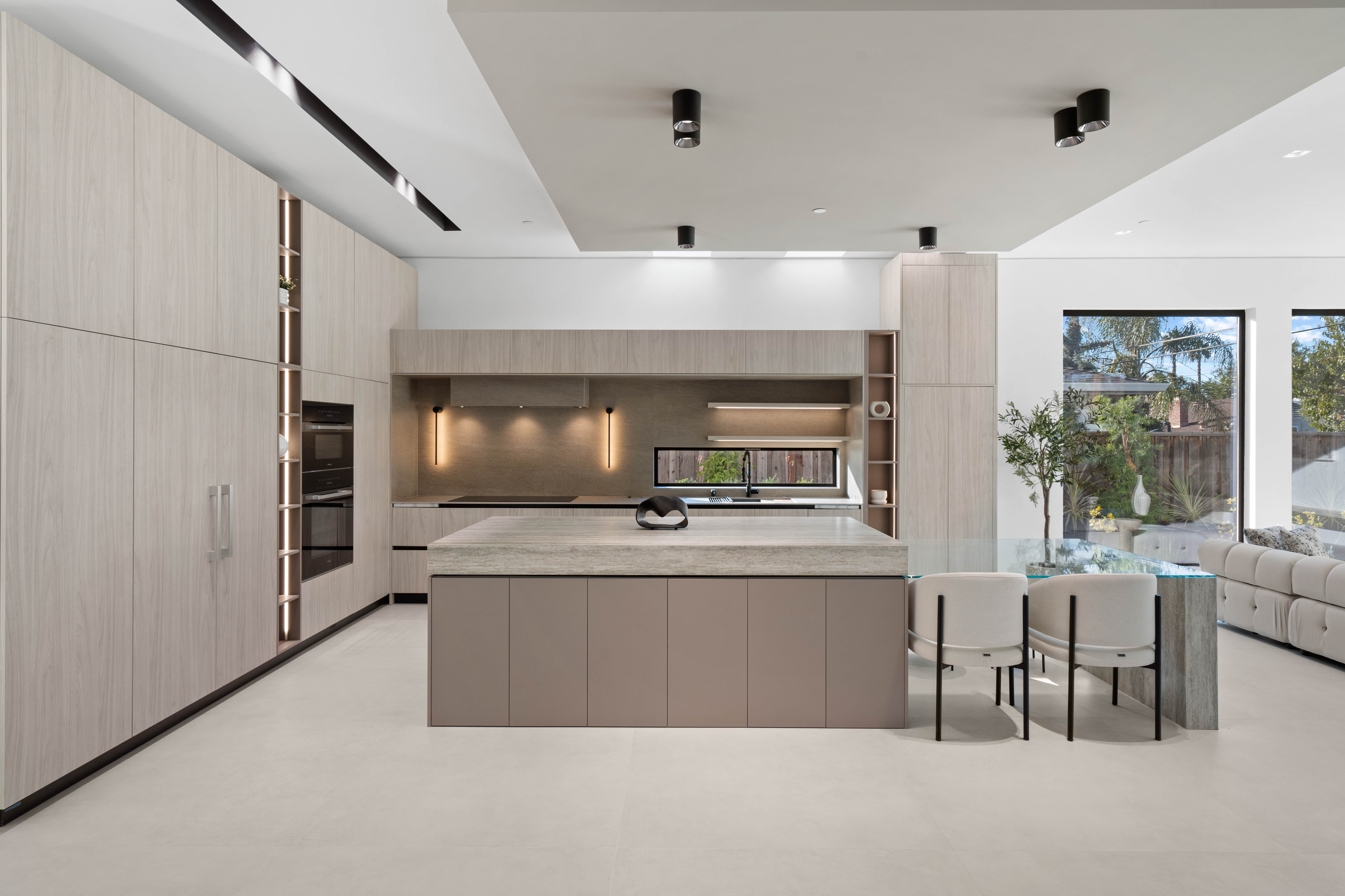 Custom modern kitchen in the award-winning Rivera Residence in Cupertino, featuring premium appliances and custom cabinetry by Ritz Builders.