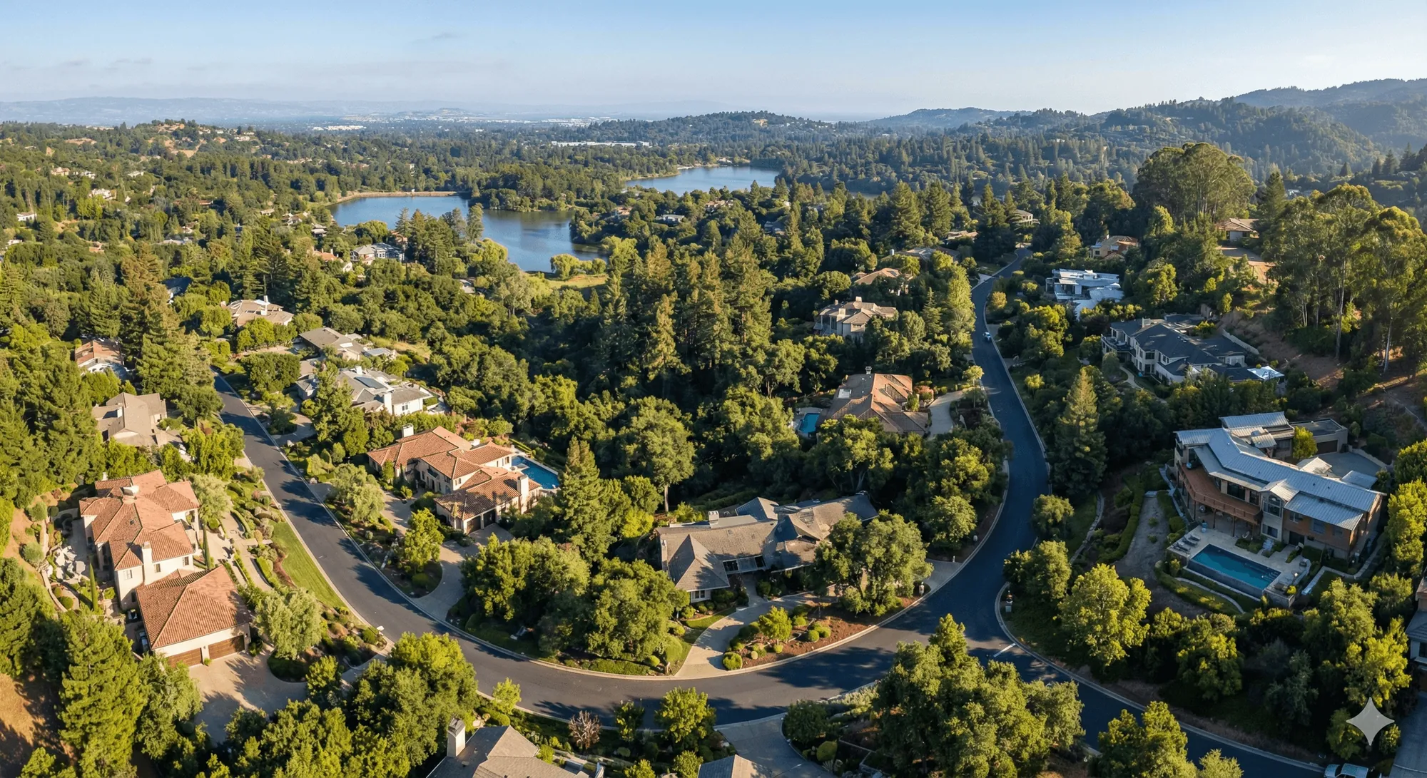 aerial view of winding roads and luxury properties in an affluent wooded community in Emerald Hills near San mateo county