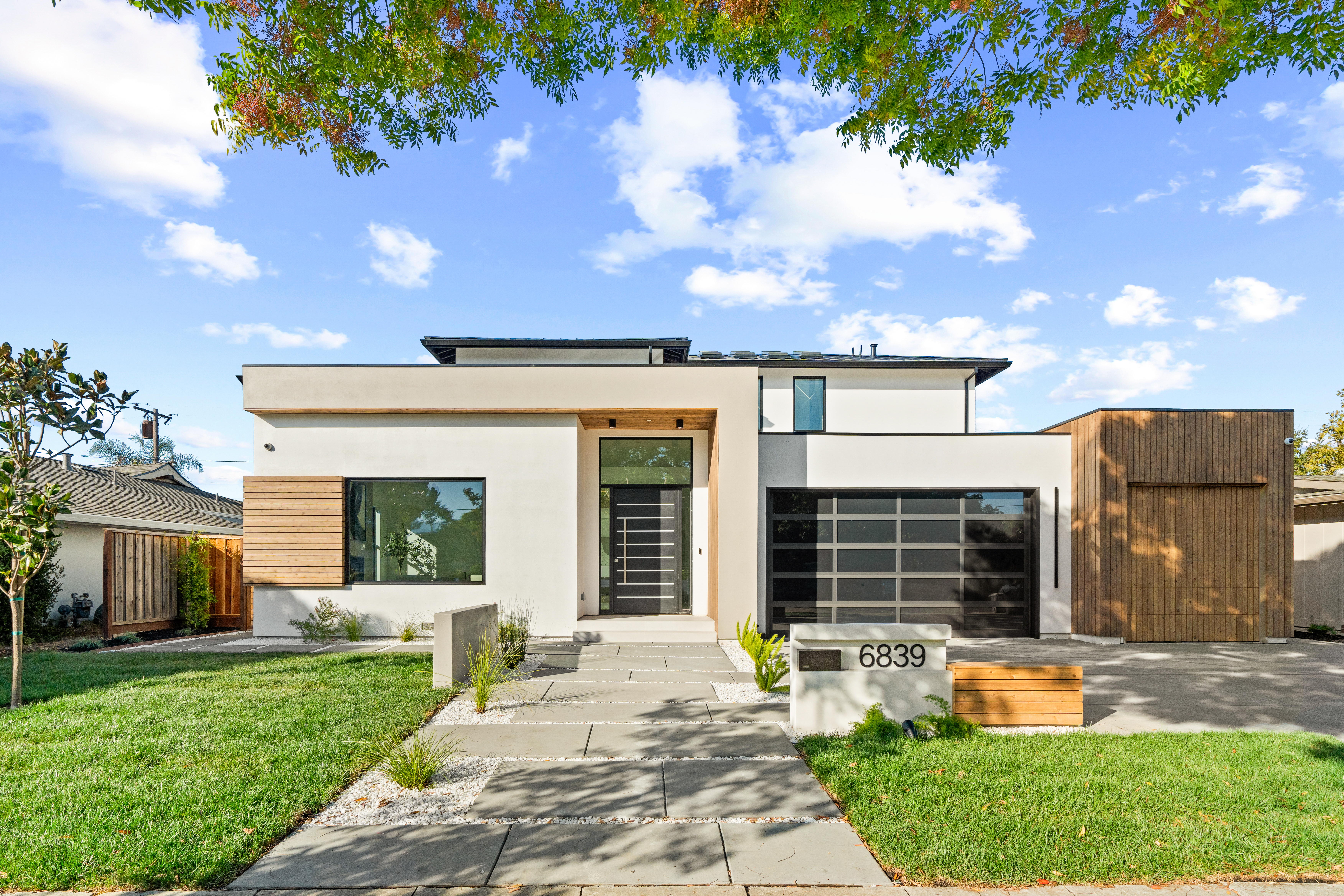 modern custom home integrated into a hillside elevation in los altos hills by ritz builders